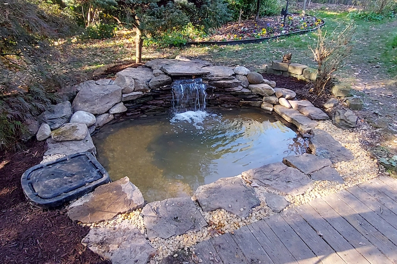 koi pond built in Upper Marlboro, MD flush with wood patio